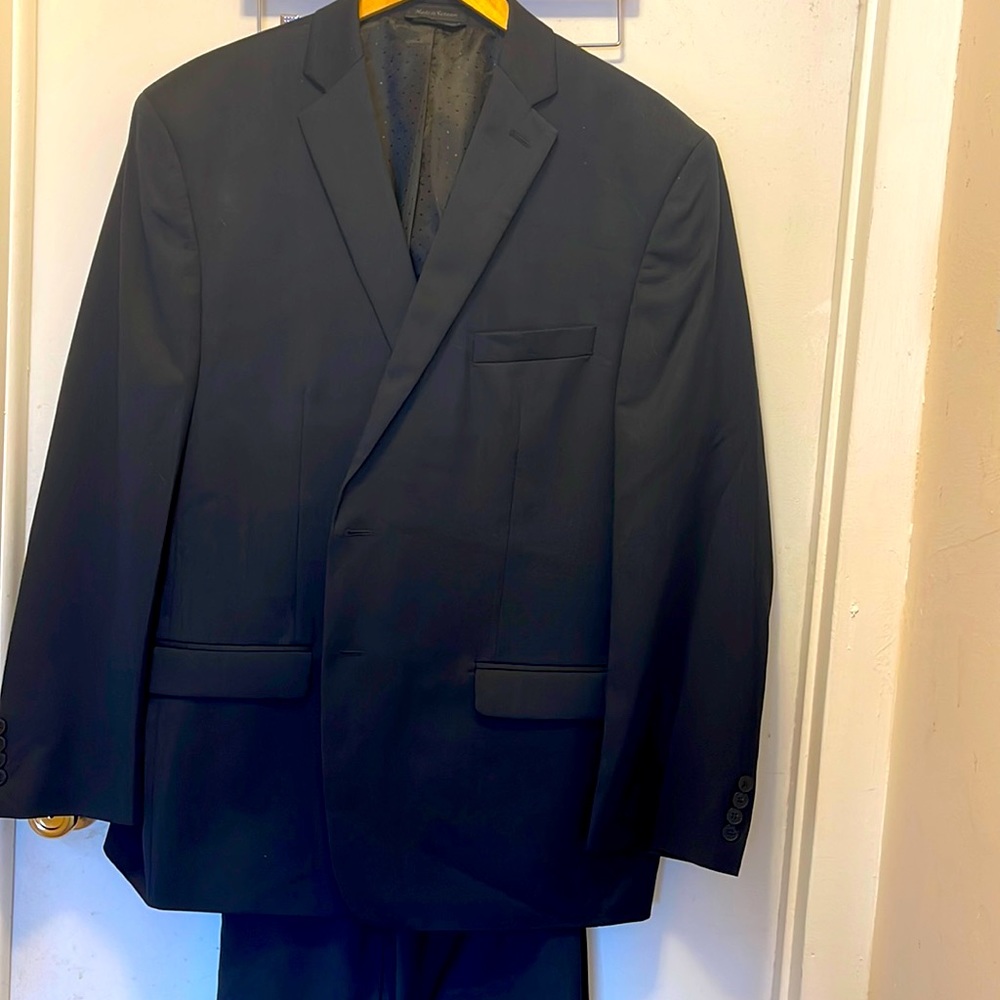 Men’s suit by Michael Strahan in black with dark blue checkered pattern.